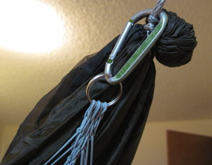 You can attach the clew using a carabiner or a cord.